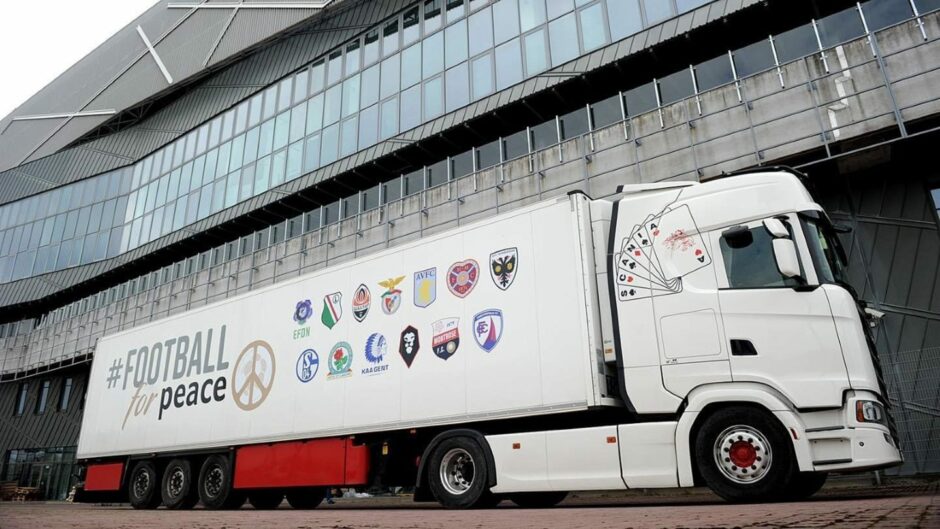 The Football for Peace lorry featuring the Montrose FC logo (bottom row, second from right)