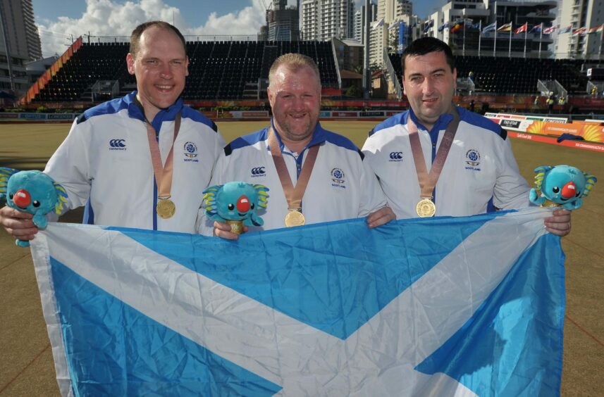 Darren, centre, celebrating his 2018 Commonwealth gold medal with Derek Oliver and Ronnie Duncan.
