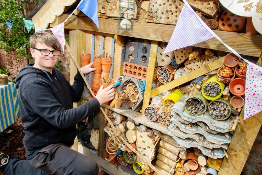 Shane Gall, 15, makes some finishing touches