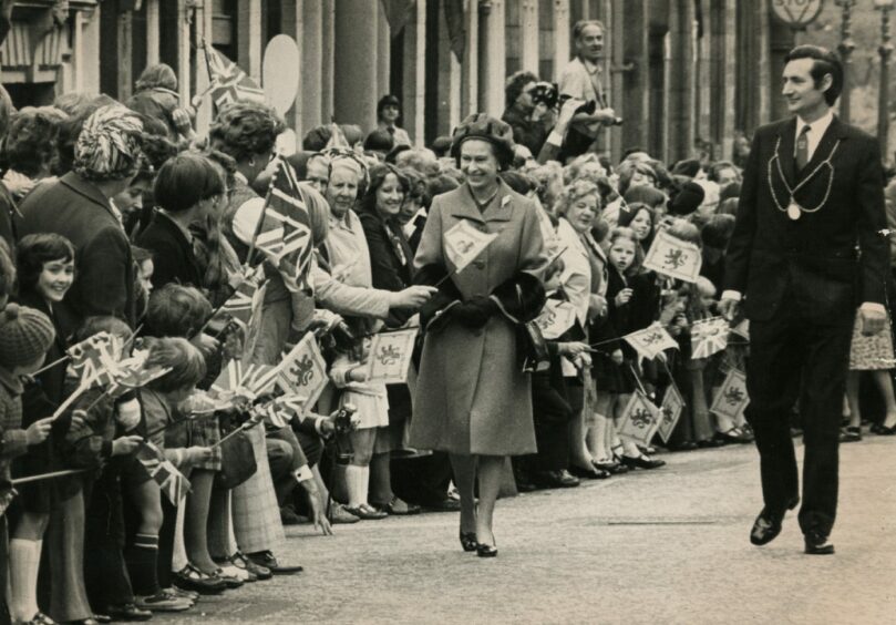 Crowds gather to greet the Queen during her visit to Dundee in 1977