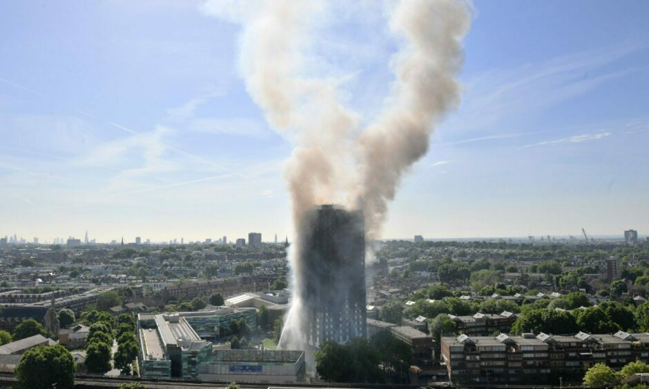 photo shows smoke billowing from the burning Glenfell Tower block in London.
