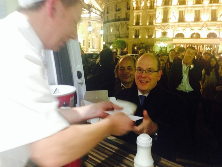 Murray Cameron serves Prince Albert of Monaco from the Murray's Chippy van