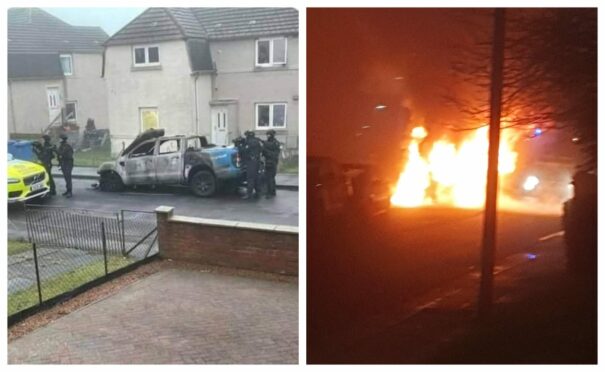 Armed police in Kinglassie and the burning vehicle.