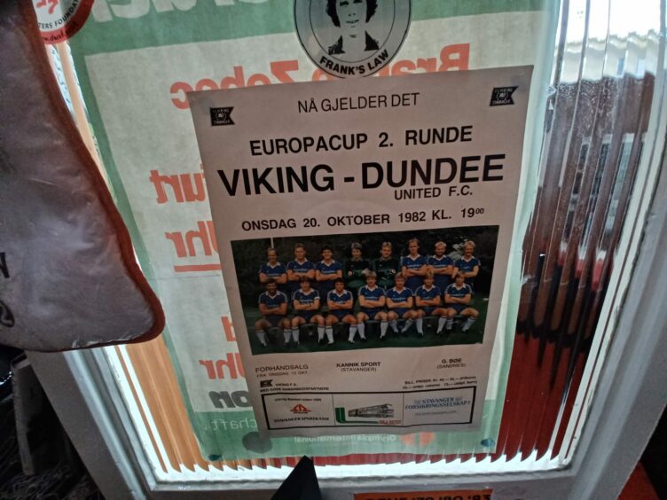 A poster in George's shop marking Dundee United's trip to Viking Stavanger.
