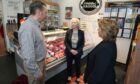 Butcher Tom Courts chats to committee members at his Burntisland High Street shop