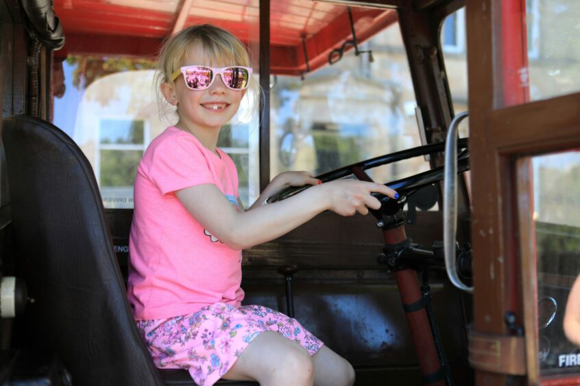 Lauren Delo, 7, celebrates the Queen's Platinum Jubilee in Perth at the wheel of a London Routemaster.