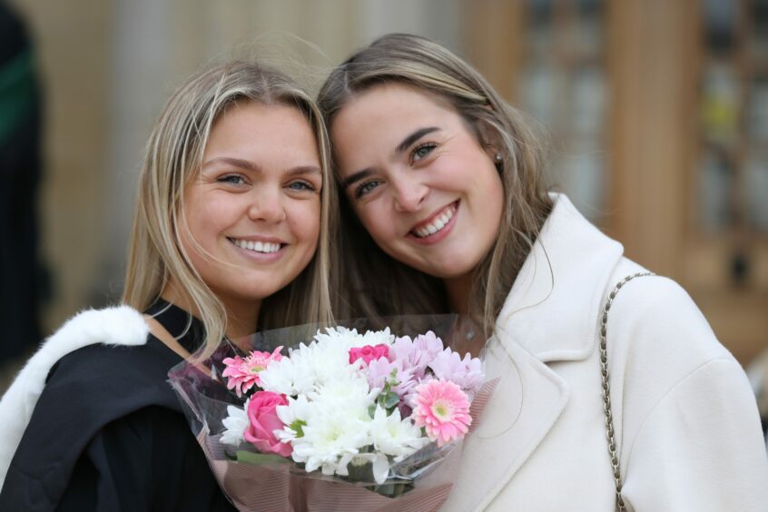 Catherine Millar has graduated in dentistry, pictured with her sister Sarah.