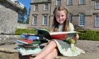 Five-year-old Zoe Fleming reading in the House of Dun grounds. Pic: Gareth Jennings/DCT Media.