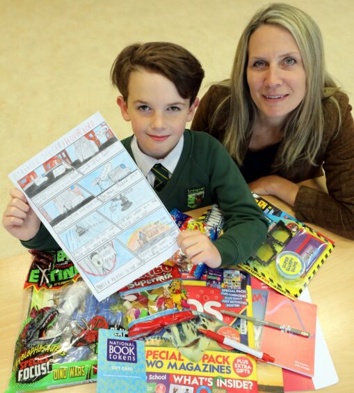 Sarah Hynie Klemen presented Kenneth with his prize pack