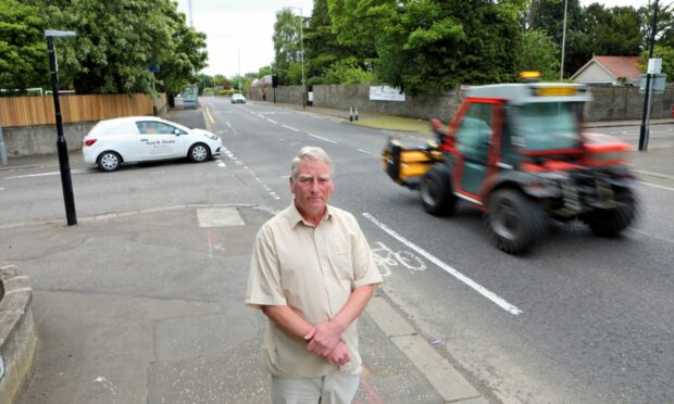 Councillor Craig Duncan at the junction, the site of regular crashes.