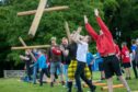 Tossing the caber at the junior games. Pic: Kim Cessford/DCT Media.