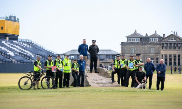 Police Scotland and The R&A on the famous Swilken Bridge.
