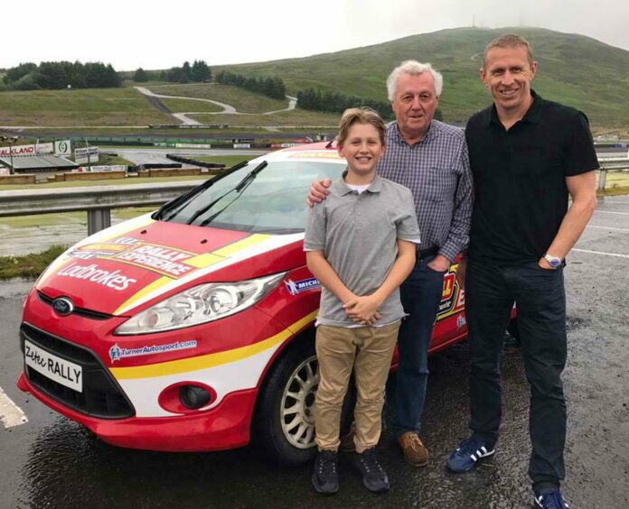 Young Max McRae with father Alister and grandad Jimmy at Knockhill for his first taste of rallying.