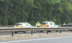 Police vehicles on the A90 near Inchture following the stop.
