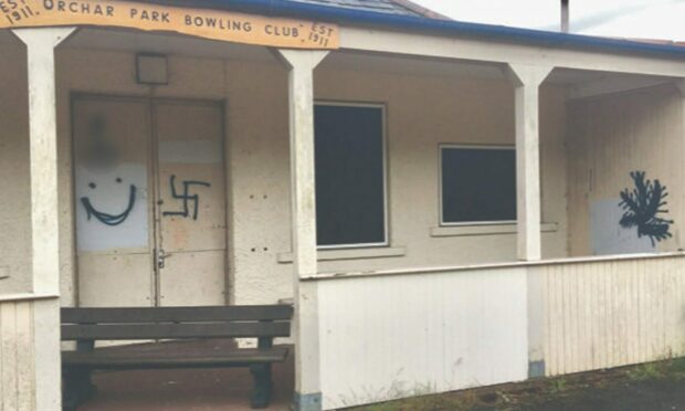 Graffiti on the walls of the former bowling pavilion at Orchar Park.
