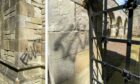 Vandals have spray painted the walls of the historic memorial chapel.