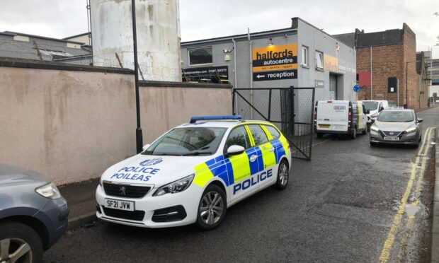 Police at Halfords Autocentre, Ure Street, Dundee.