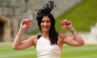 Eve Muirhead holds her OBE and MBE.