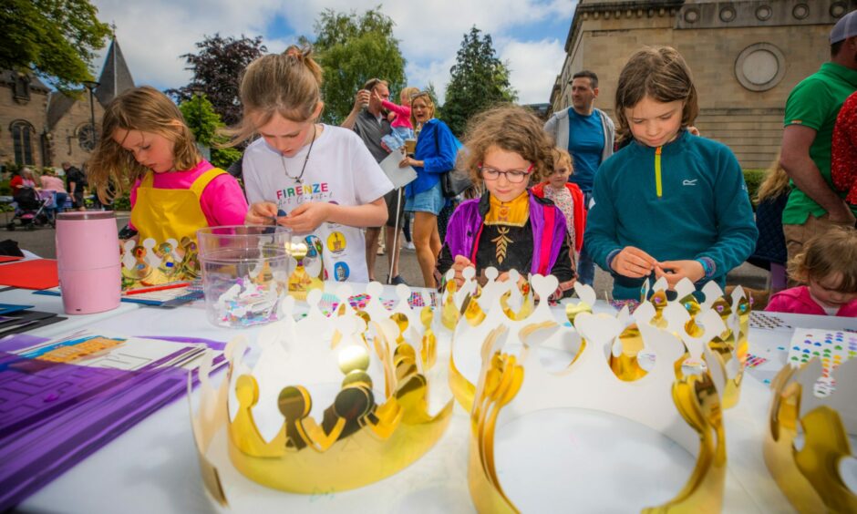 Youngsters celebrate the Queen's Platinum Jubilee in Perth by making crowns.