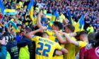 Ukraine's Roman Yaremchuk celebrates in front of the fans.