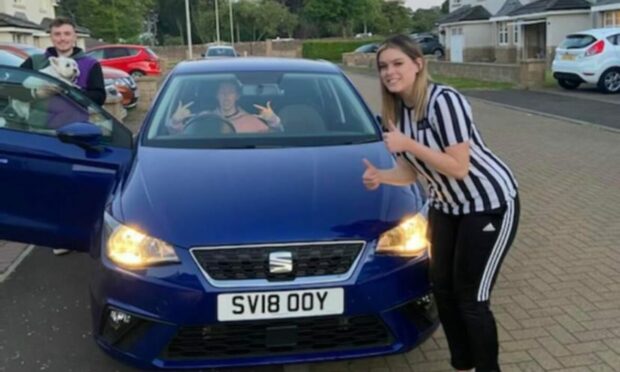 Emily, her sister Jessica and her boyfriend Aaron with the stolen car.