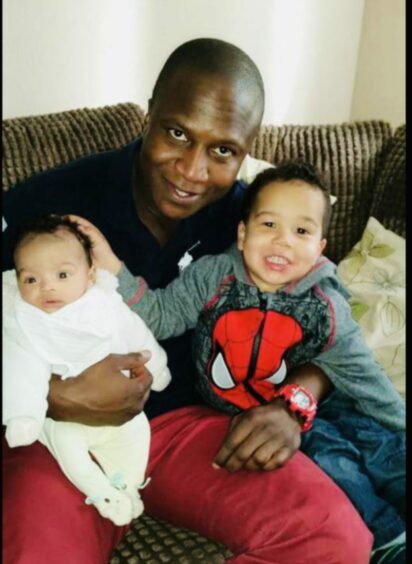 To go with story by Kirsty McIntosh. For use in coverage of the Sheku Bayoh inquiry Picture shows; Sheku Bayoh with his sons (L-R) Isaac and Tyler (permission to use photos of children confirmed by family lawyer Aamer Anwar). Unknown. Supplied by Sheku Bayoh family Date; Unknown