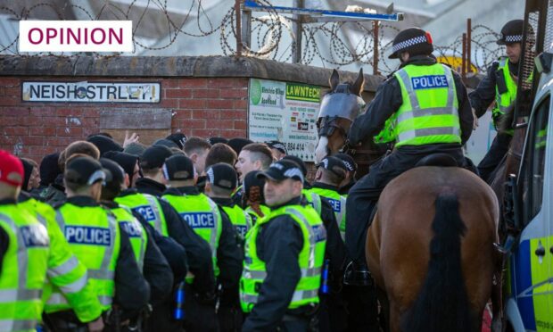 Barbed wire and mounted police outside Tannadice.