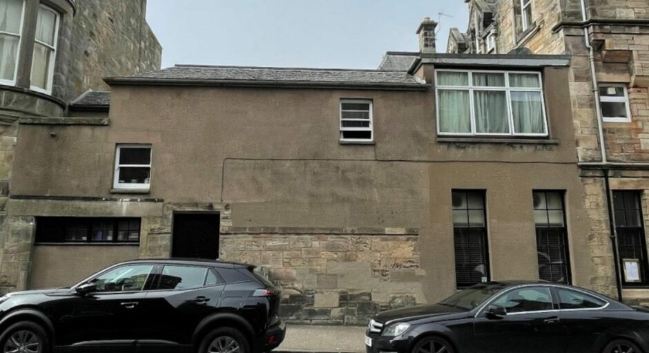 Demolition of the existing post-war extension would make way for two new apartments.