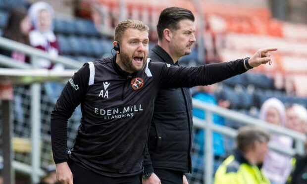 Adam Asghar (left) in the Dundee United technical area with head coach Tam Courts