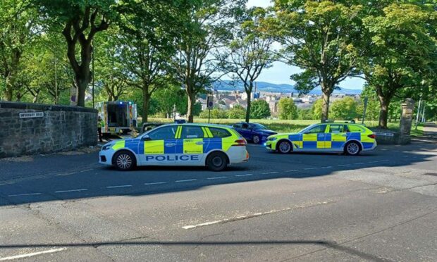 Police at Infirmary Brae, Dundee, following the crash.