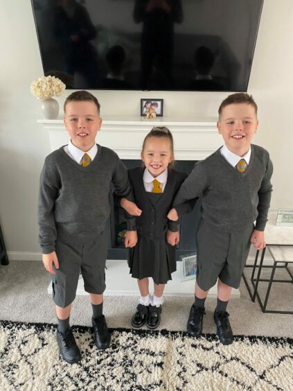 Rosie with twins Keir and Luca who were diagnosed with autism and ADHD.