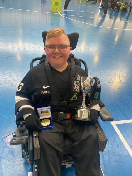 Logan Mitchelson with the FA Disability Cup.