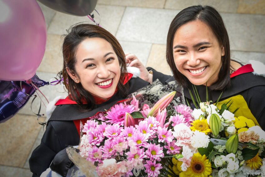 Carmen Chan, 25, with her friend Wei Xin Wong, 27, graduate in Medicine from summer 2021.