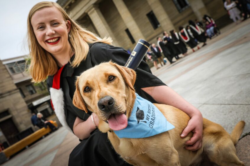 Ellie Stewart, 25, graduates in medicine and celebrates with her pooch Hugo