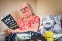 'Beyhive momma' Gwen Denholm surrounded by her Beyoncé merchandise.