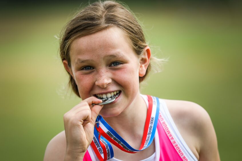 Emma Knox, 12, scoops second place in the 800m race