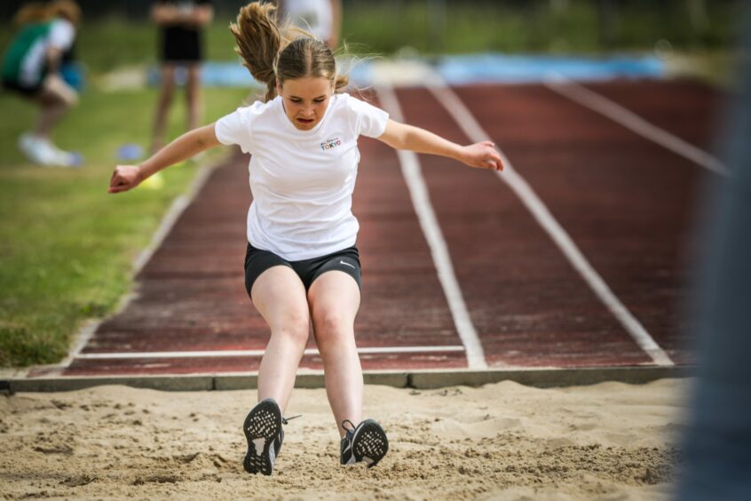 Sophie Young, 11, from Viewlands PS takes on the long jump. 