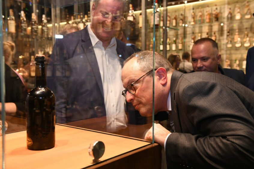 Spectators admiring the centre piece of Valentino Zagatti  whisky collection.