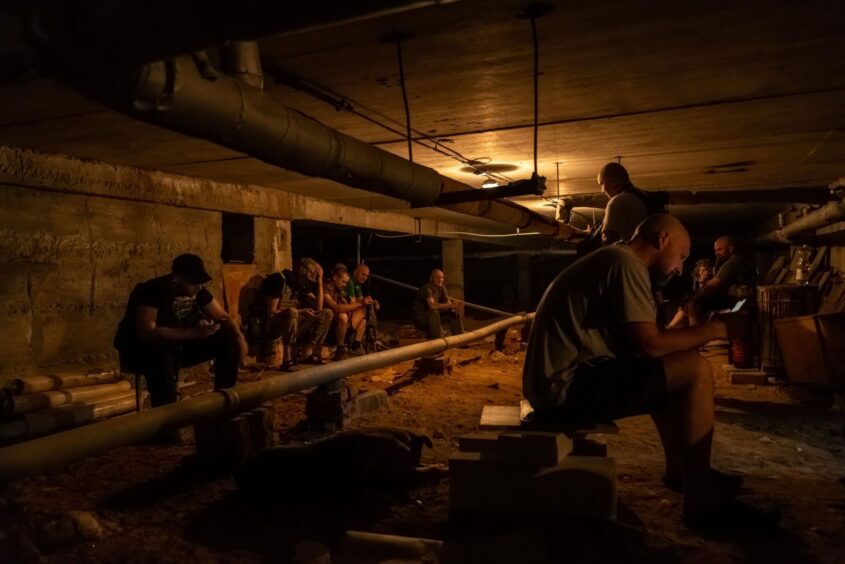 Volunteer members of the 206th battalion of the Kiev territorial defence in a shelter during a bomb alarm between Mykolaiv and Kherson, Ukraine, 31/05/22.