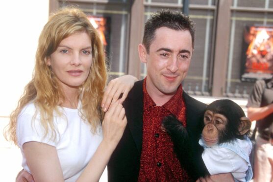 Cumming alongside Renee Russo and Tonka at the 1997 premiere of Buddy in Los Angeles. Photo by Peter Brooker/Shutterstock