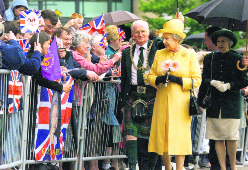 The Queen meets the public with Lord Provost John Letford in Dundee City Square as part of her Golden Jubilee tour.