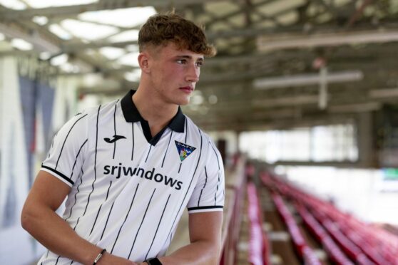 Dunfermline Athletic's Lewis McCann models the new home shirt