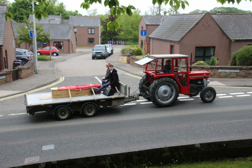 John's final trip to his funeral was taken through Arbroath by tractor and bogie.