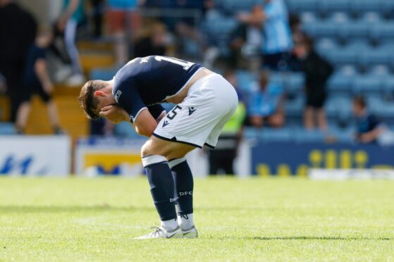 Dejected Dundee midfielder Josh Mulligan at full-time against Partick Thistle.