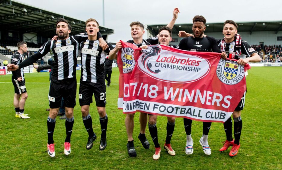 Smith, third from the right, toasts St Mirren's triumph.