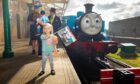 Three-year-old Ivy Farrar from Cruden Bay ready for her trip on Thomas the Tank Engine. Pic: Paul Reid.