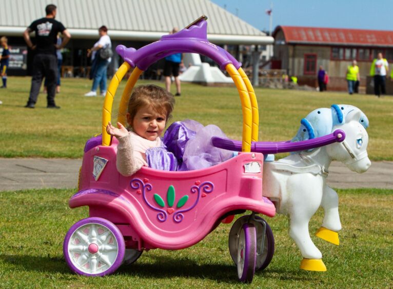 Lilly-Anne French, 2, in her transport. 