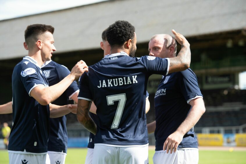 Dundee celebrate Jakubiak's penalty against Hamilton.