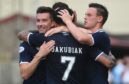 Dundee players celebrate against Queen's Park.