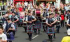 A parade kicks off Burntisland Highland Games.